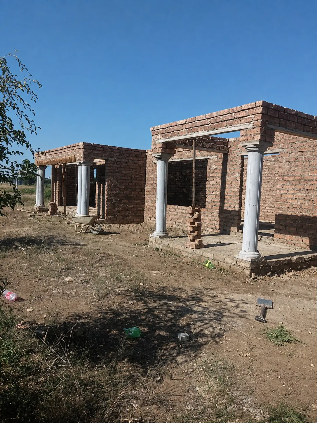 Pillared brick facade nearing roof stage